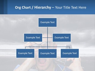 A Man Holding A Cell Phone Up To His Face PowerPoint Template