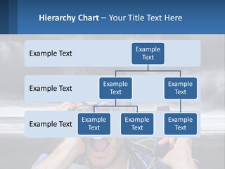 A Man Holding A Cell Phone Up To His Face PowerPoint Template