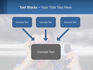 A Man Holding A Cell Phone Up To His Face PowerPoint Template