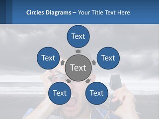 A Man Holding A Cell Phone Up To His Face PowerPoint Template