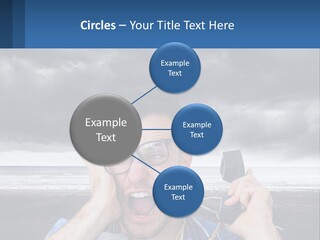 A Man Holding A Cell Phone Up To His Face PowerPoint Template
