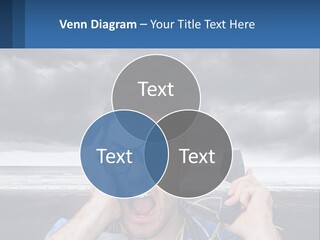 A Man Holding A Cell Phone Up To His Face PowerPoint Template