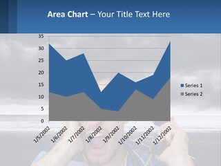 A Man Holding A Cell Phone Up To His Face PowerPoint Template