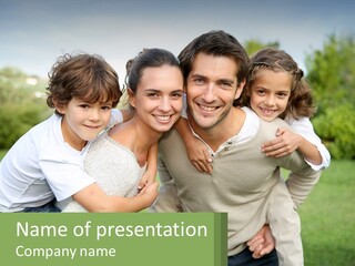 A Family Is Posing For A Picture In The Park PowerPoint Template