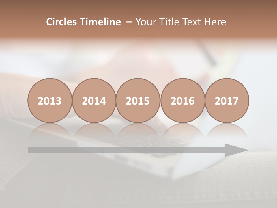 A Person Using A Laptop With A Credit Card In Their Hand PowerPoint Template