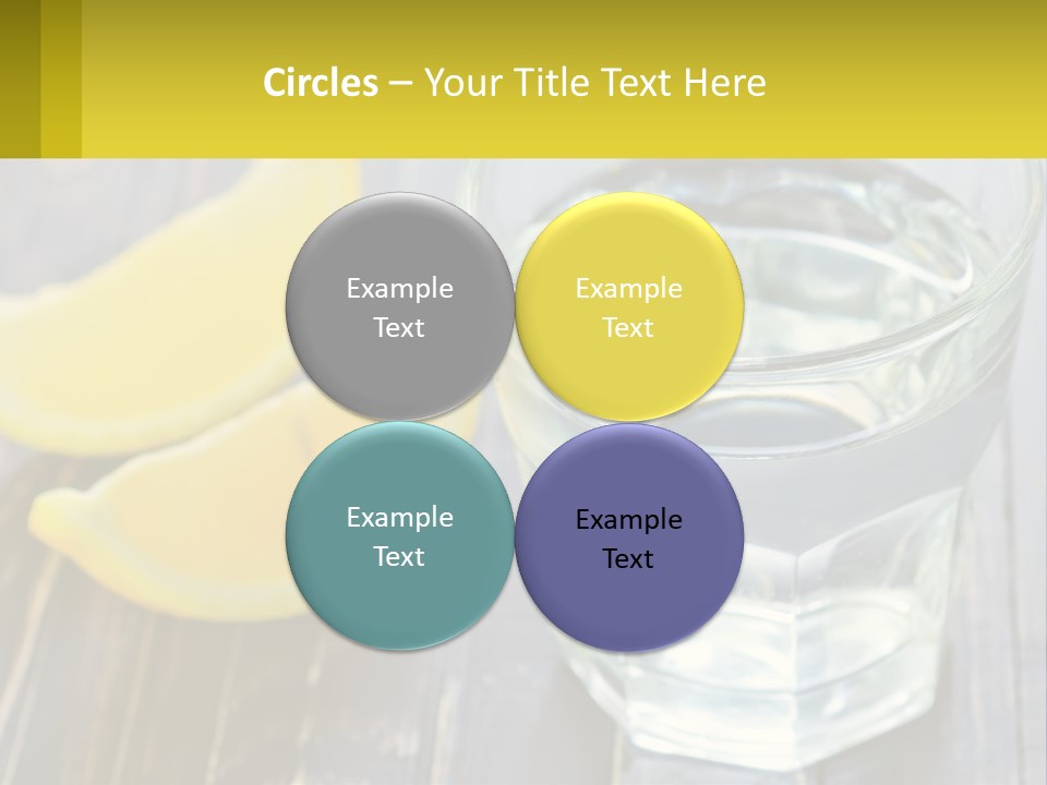 A Glass Of Water With Lemons On A Wooden Table PowerPoint Template
