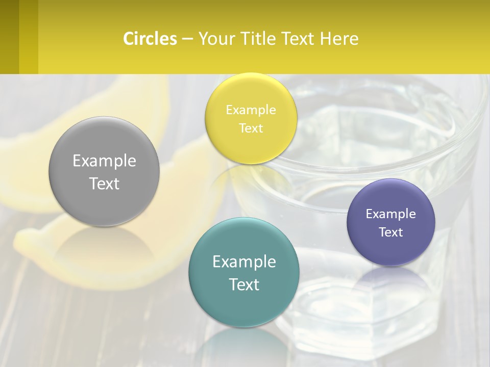 A Glass Of Water With Lemons On A Wooden Table PowerPoint Template