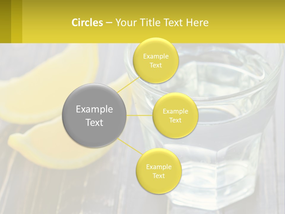 A Glass Of Water With Lemons On A Wooden Table PowerPoint Template