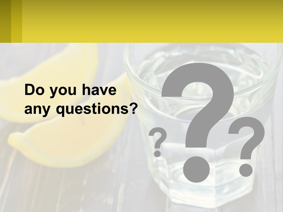 A Glass Of Water With Lemons On A Wooden Table PowerPoint Template