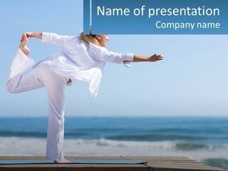 A Woman Doing A Yoga Pose On The Beach PowerPoint Template
