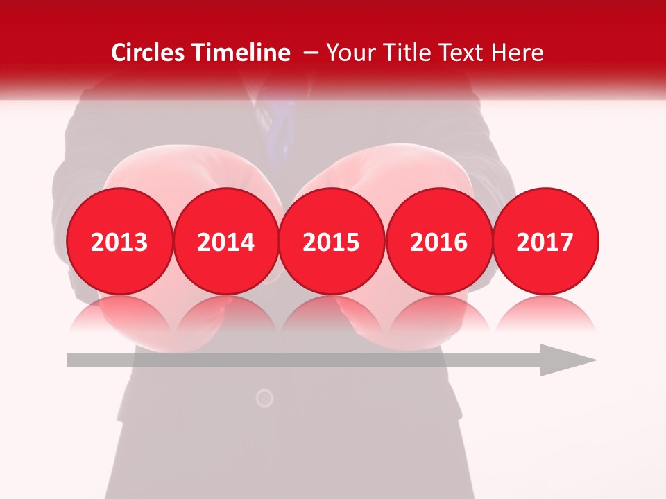 A Man In A Suit And Tie Wearing Red Boxing Gloves PowerPoint Template