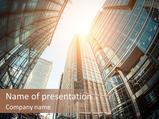 A Group Of Skyscrapers With The Sun Shining Through Them PowerPoint Template