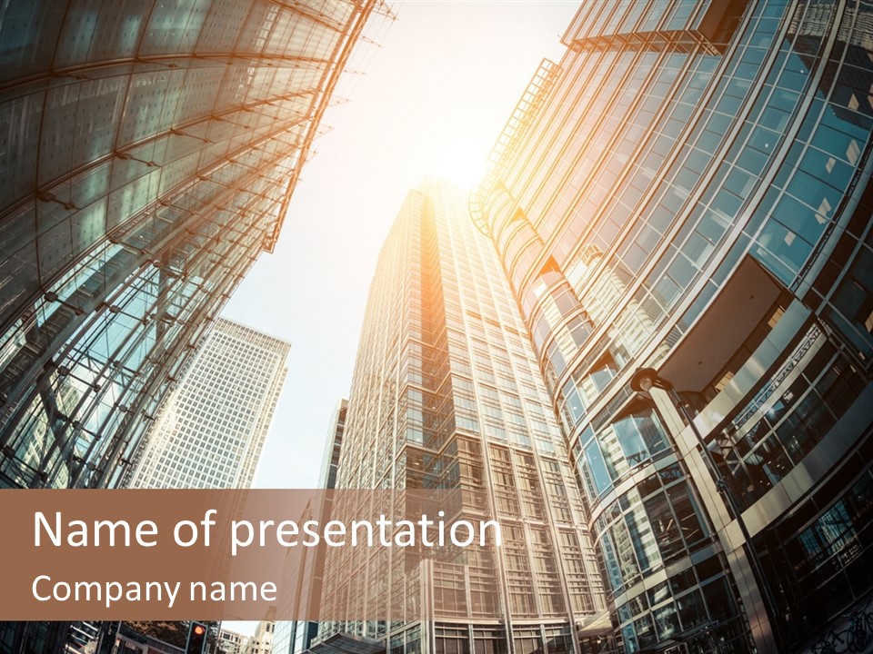 A Group Of Skyscrapers With The Sun Shining Through Them PowerPoint Template