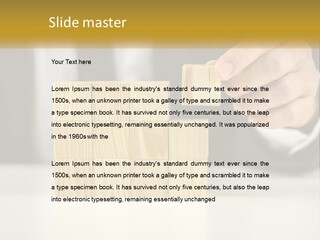 A Business Man Stacking Wooden Blocks On Top Of A Table PowerPoint Template