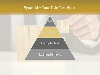 A Business Man Stacking Wooden Blocks On Top Of A Table PowerPoint Template