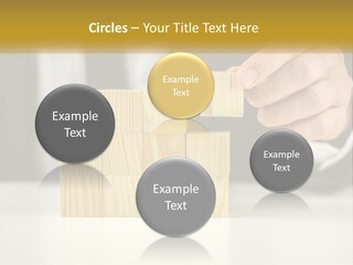 A Business Man Stacking Wooden Blocks On Top Of A Table PowerPoint Template