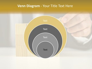 A Business Man Stacking Wooden Blocks On Top Of A Table PowerPoint Template