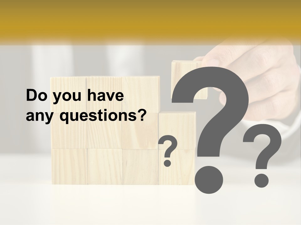 A Business Man Stacking Wooden Blocks On Top Of A Table PowerPoint Template