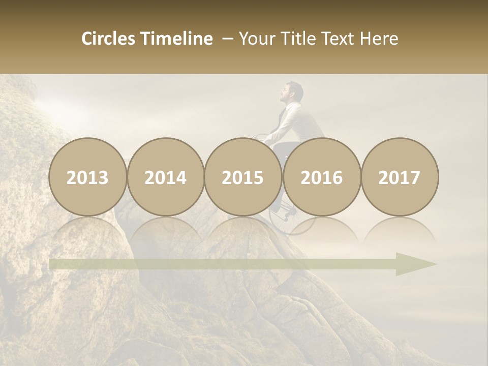 A Man Riding A Bike On Top Of A Mountain PowerPoint Template