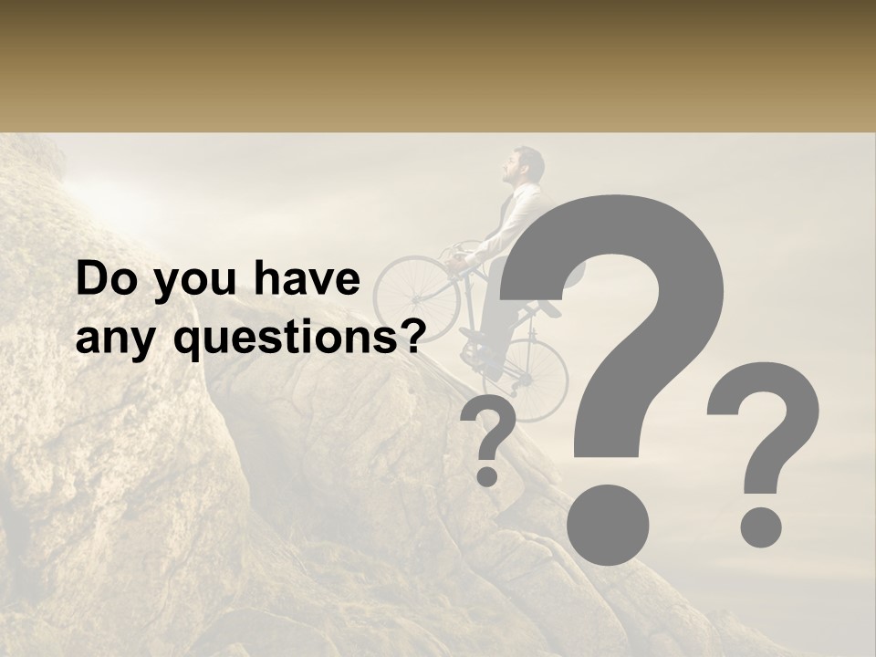 A Man Riding A Bike On Top Of A Mountain PowerPoint Template