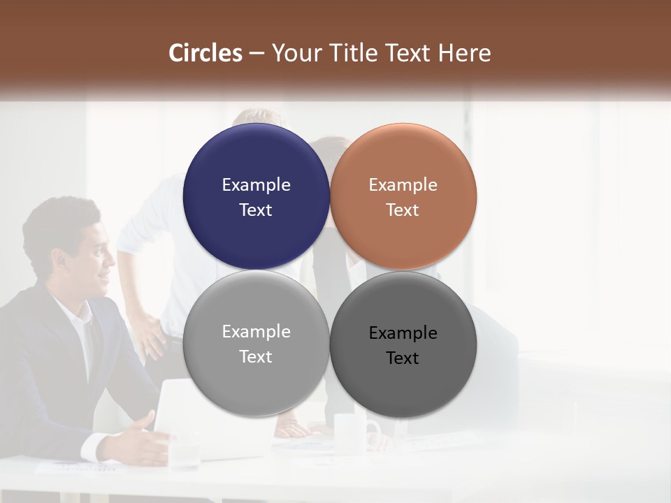 A Group Of People Sitting Around A Table With A Laptop PowerPoint Template