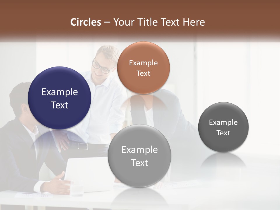 A Group Of People Sitting Around A Table With A Laptop PowerPoint Template