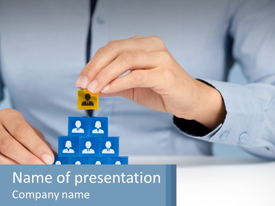 A Person Placing A Piece Of Blue Block On Top Of A Pyramid PowerPoint Template