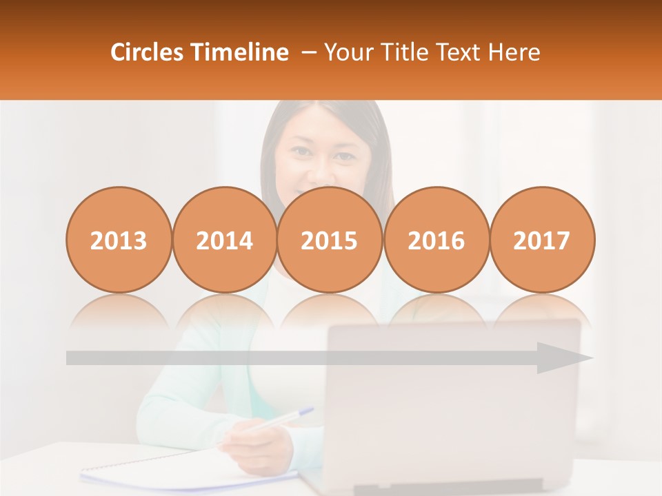 A Woman Sitting In Front Of A Laptop Computer PowerPoint Template