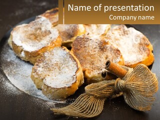 A Plate Of Pastries On A Table With Cinnamon Sticks PowerPoint Template