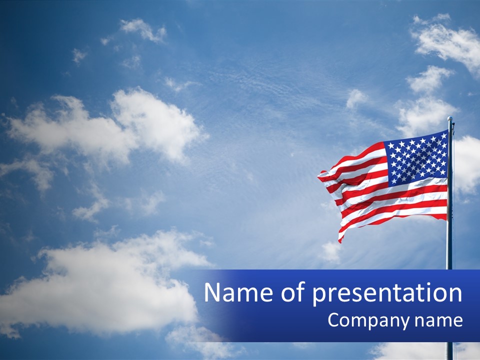 An American Flag Is Flying In The Blue Sky PowerPoint Template