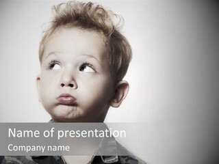 A Young Boy Is Making A Funny Face PowerPoint Template