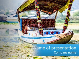 A Boat With A Canopy Is Sitting In The Water PowerPoint Template