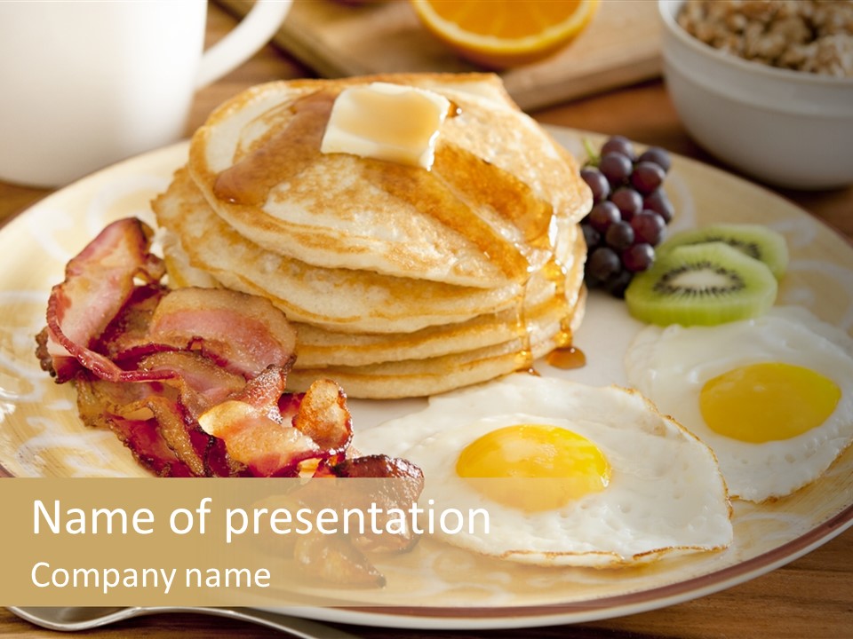 A Plate Of Breakfast Food With Eggs, Bacon, And Pancakes PowerPoint Template