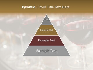 A Row Of Wine Glasses Filled With Red Wine PowerPoint Template