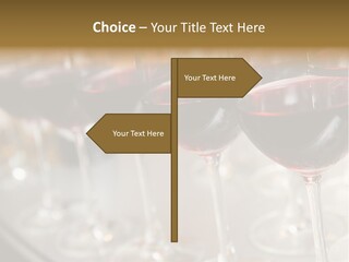 A Row Of Wine Glasses Filled With Red Wine PowerPoint Template