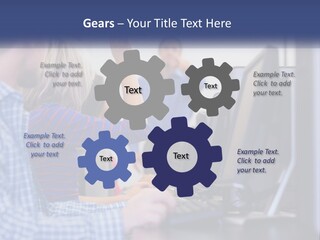 A Group Of People Standing Around A Computer Screen PowerPoint Template