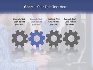 A Group Of People Standing Around A Computer Screen PowerPoint Template