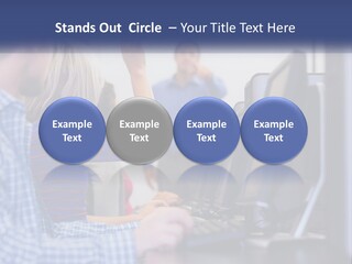 A Group Of People Standing Around A Computer Screen PowerPoint Template