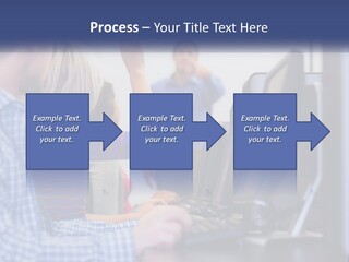 A Group Of People Standing Around A Computer Screen PowerPoint Template