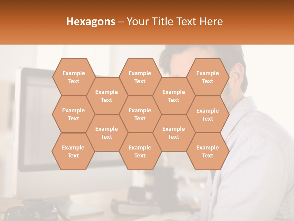 A Man Sitting At A Desk In Front Of A Computer PowerPoint Template