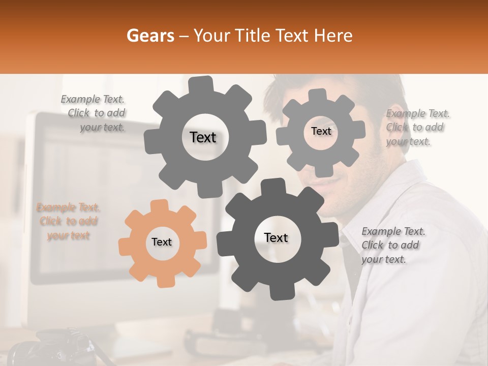 A Man Sitting At A Desk In Front Of A Computer PowerPoint Template