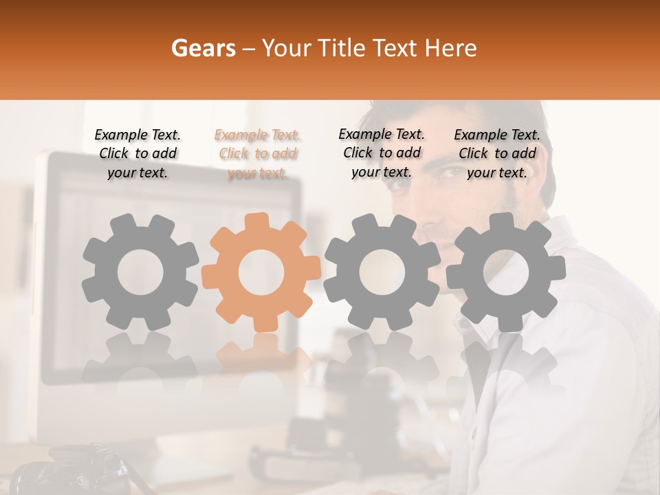 A Man Sitting At A Desk In Front Of A Computer PowerPoint Template