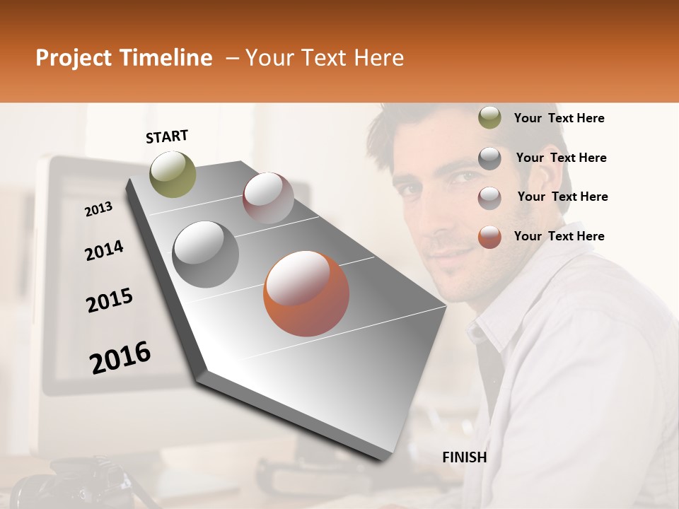 A Man Sitting At A Desk In Front Of A Computer PowerPoint Template