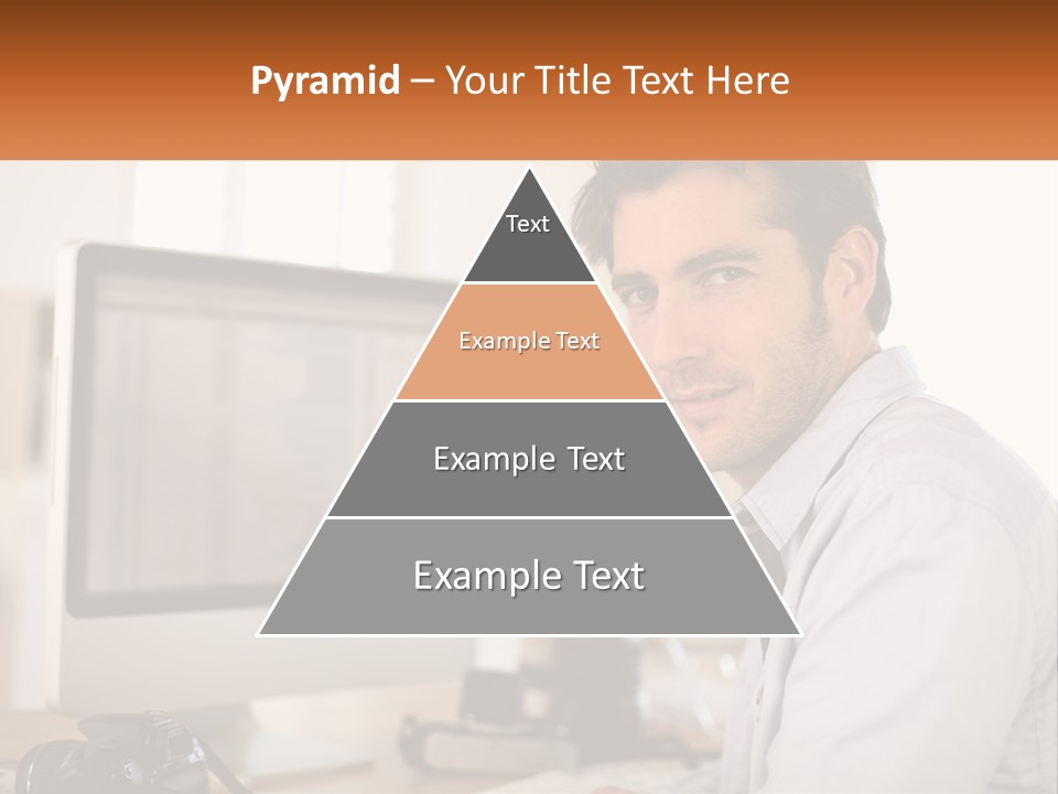 A Man Sitting At A Desk In Front Of A Computer PowerPoint Template
