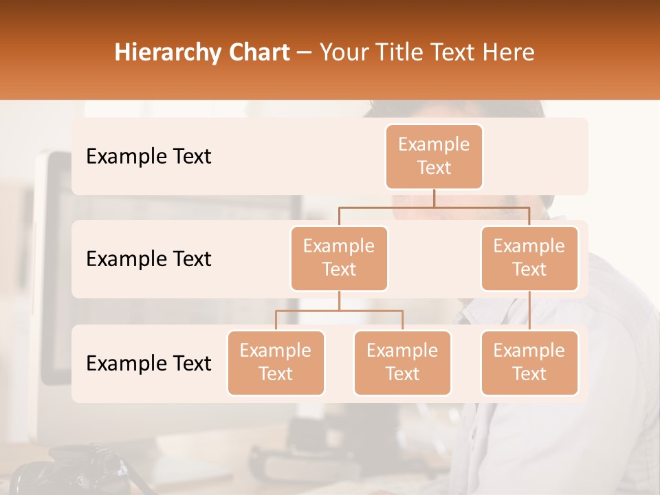 A Man Sitting At A Desk In Front Of A Computer PowerPoint Template