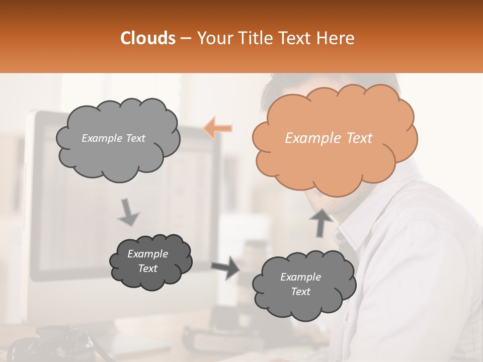 A Man Sitting At A Desk In Front Of A Computer PowerPoint Template