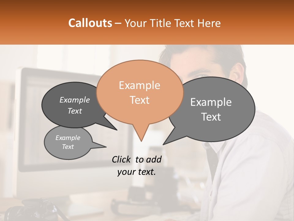 A Man Sitting At A Desk In Front Of A Computer PowerPoint Template
