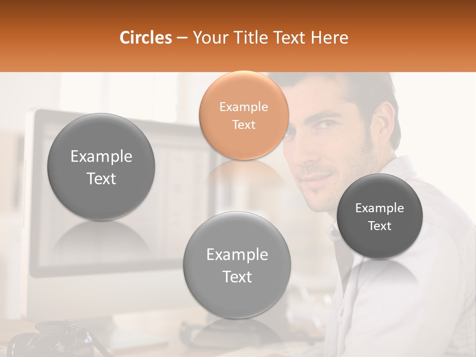 A Man Sitting At A Desk In Front Of A Computer PowerPoint Template