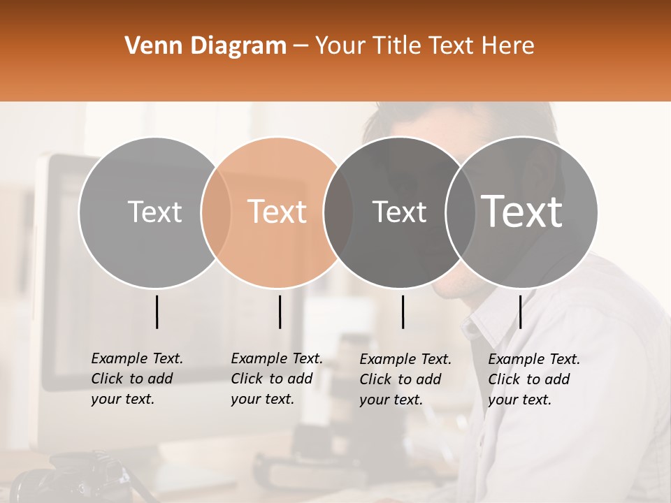 A Man Sitting At A Desk In Front Of A Computer PowerPoint Template