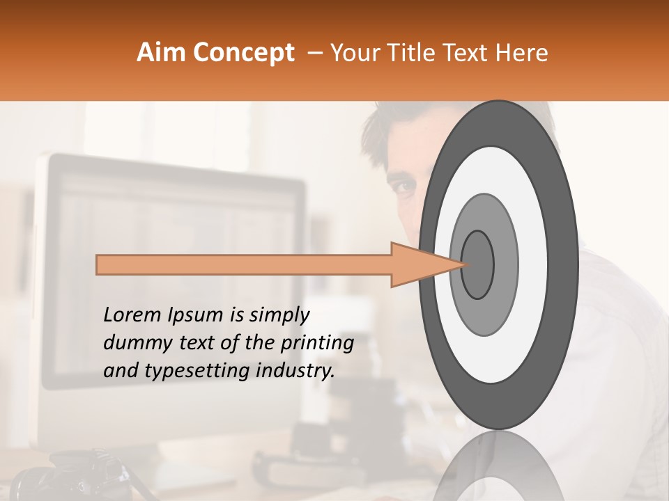 A Man Sitting At A Desk In Front Of A Computer PowerPoint Template